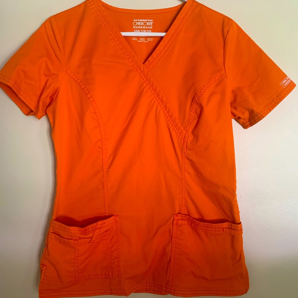 Orange Cherokee scrub top barely used. Size small